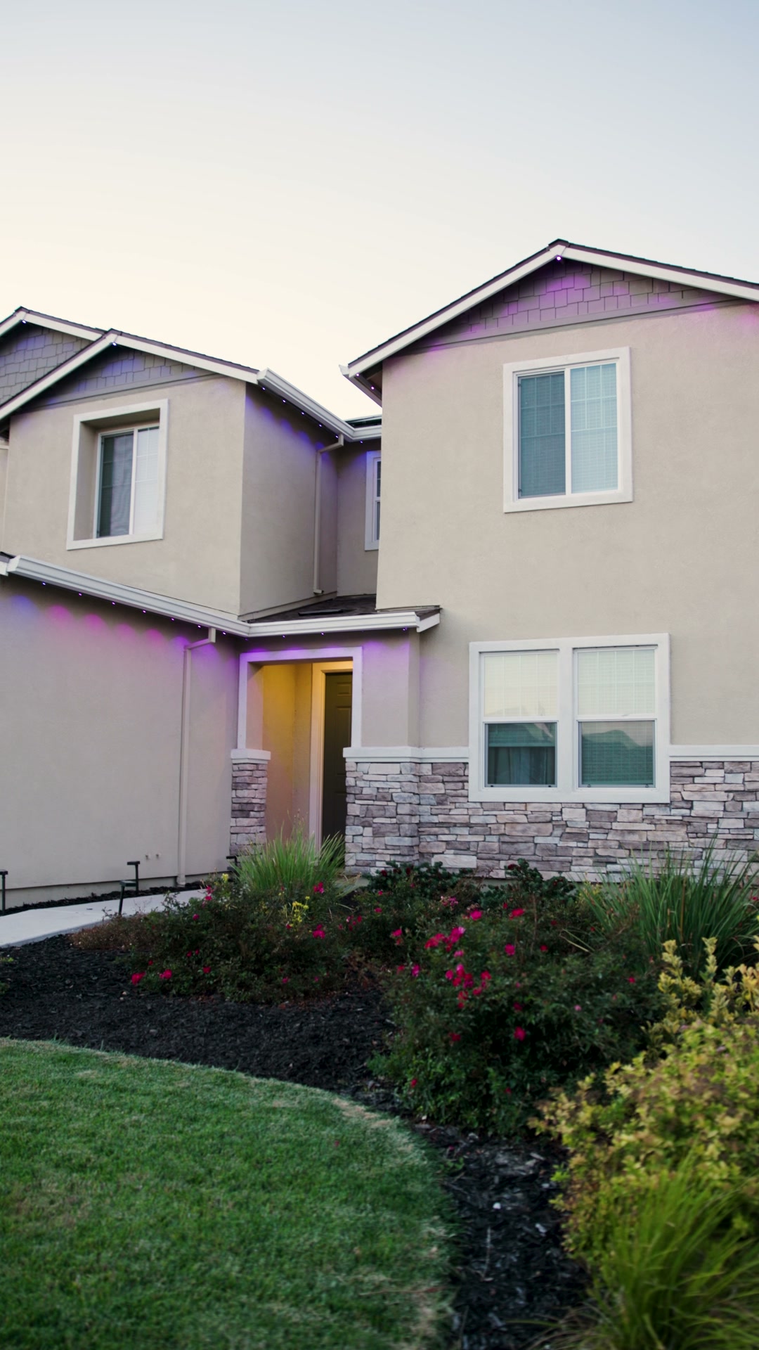 Two-story Central Valley home with permanent roofline lighting